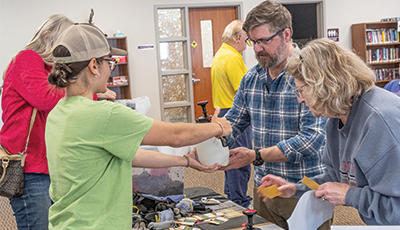 A ground around a table learning to grow native plants